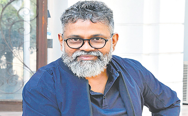 Sukumar-blue-shirt.jpg