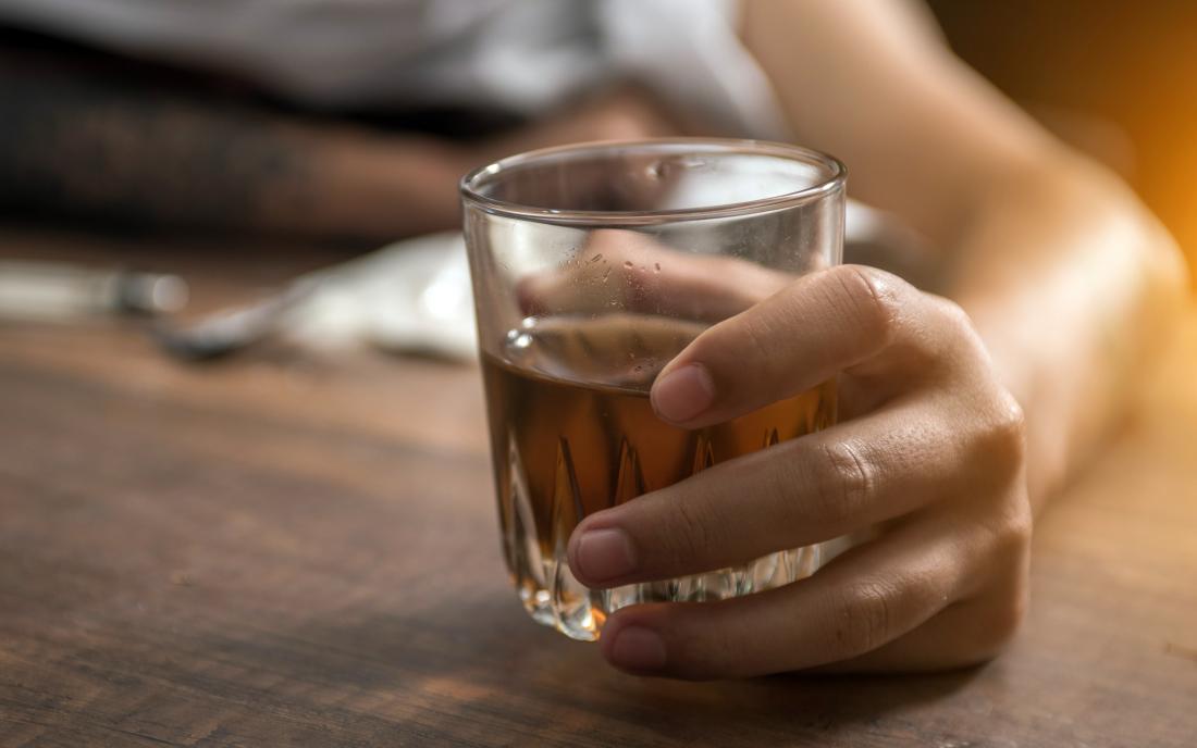 intoxication-holding-a-glass-of-alcohol.jpg