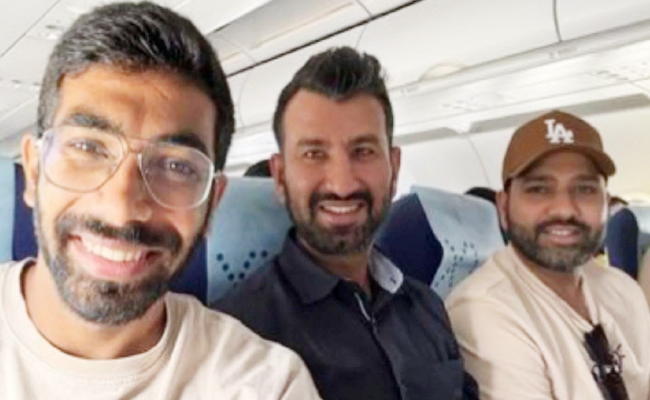 pujara-with-bumrah-rohit.jpg