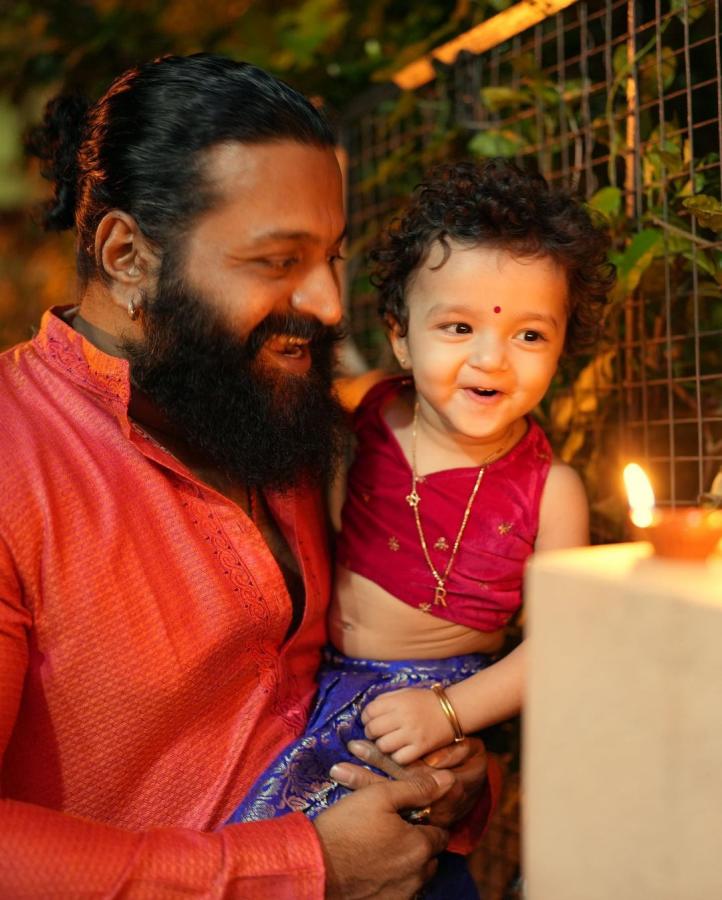 Rishab-Shetty-with-daughter.jpg 12