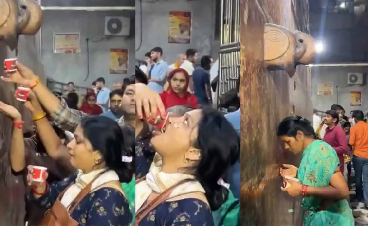 Devotees_20drink_20AC_20water.jpg