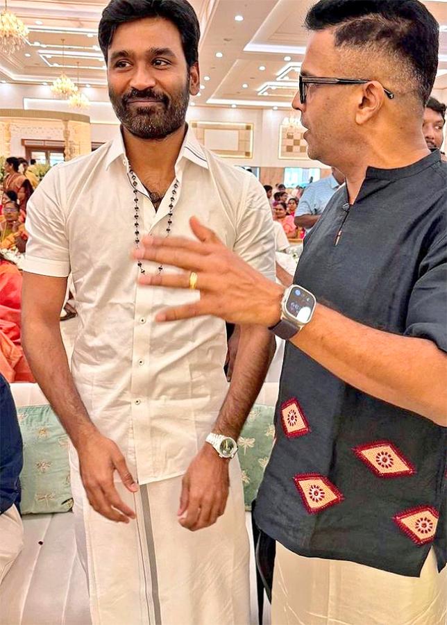 Nayanthara_2C_20Dhanush_20attend_20Idli_20Kadai_20producer_20Wedding_20Photos_9.jpg 8