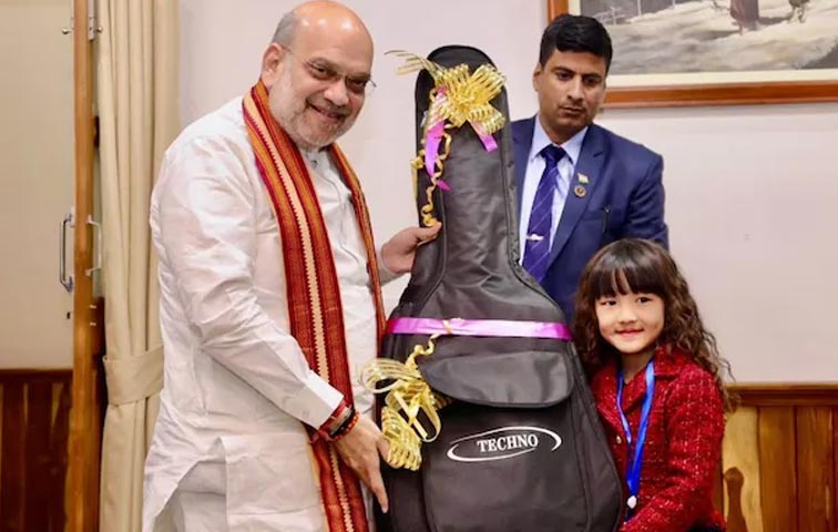 Amit-Shah-Gifts-Guitar-To-M.jpg