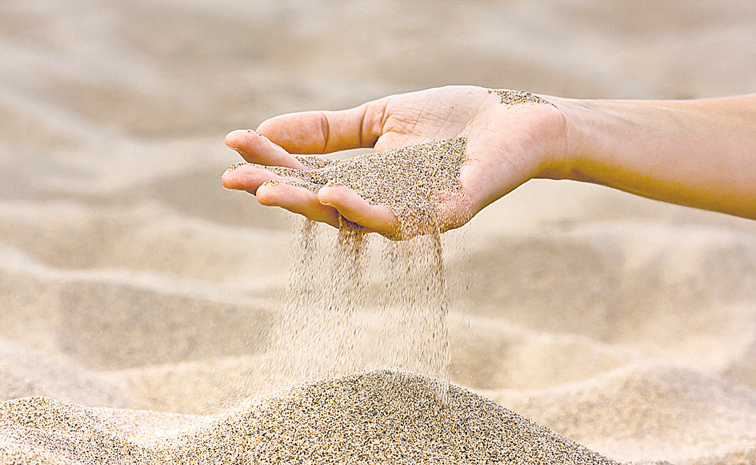 SAND-POURING-IN-HAND-598542.jpg