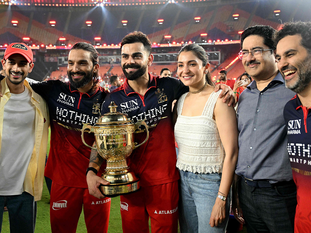 IPL_202026_20_20RCB_20_20Players_20Celebrate_20With_20the_20Trophy_20After_20Winning__20_282_29.jpg 2