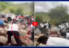 మద్యం బాటిళ్ల లారీ బోల్తా.. ఎగబడ్డ జనం