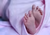 రోడ్డు పక్కన.. ప్లాస్టిక్ కవర్లో నవజాత శిశువు