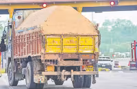 Sand lorries In Hyderabad roads - Sakshi